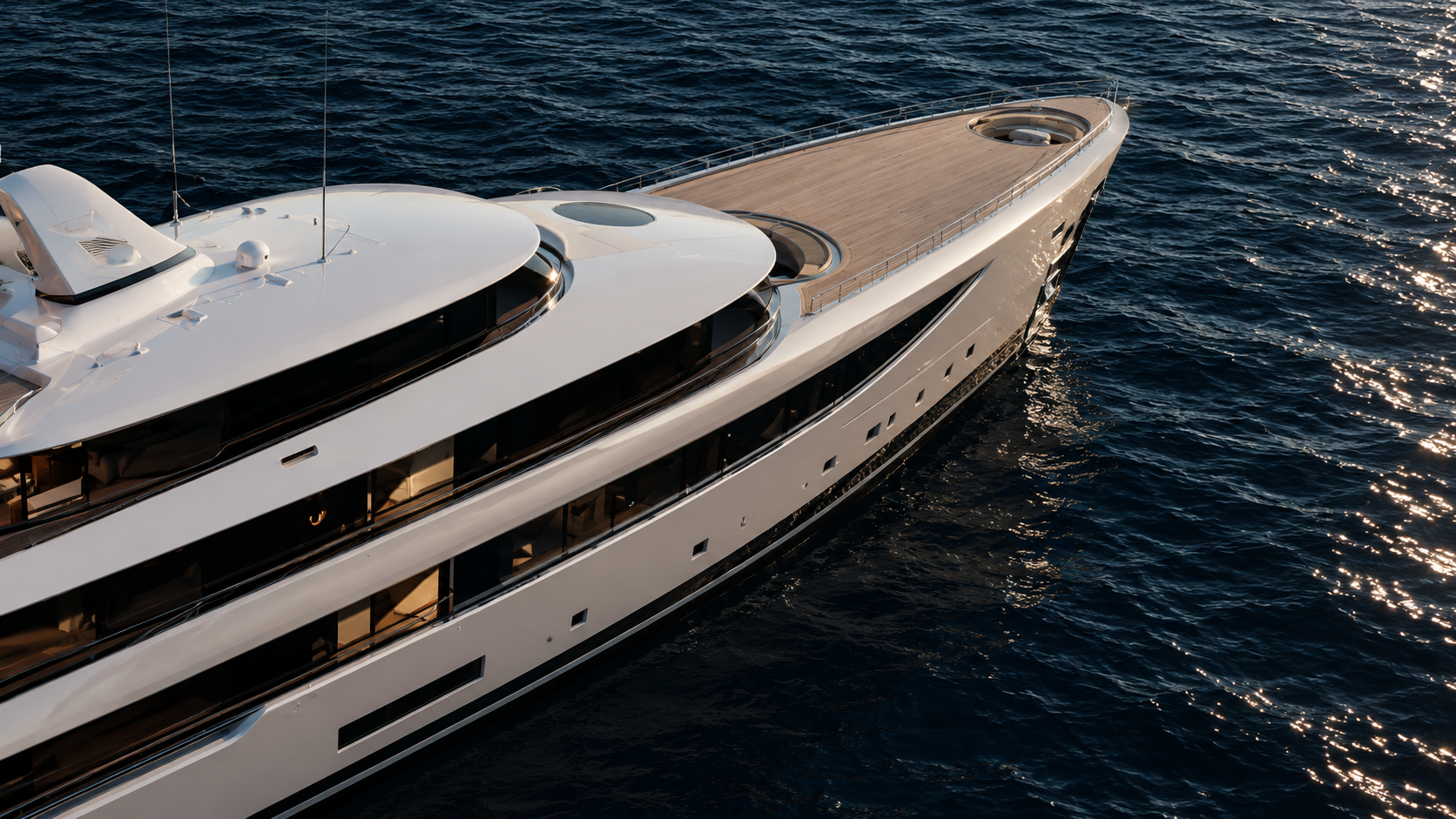 Superyacht deck seen from above in golden-hour light