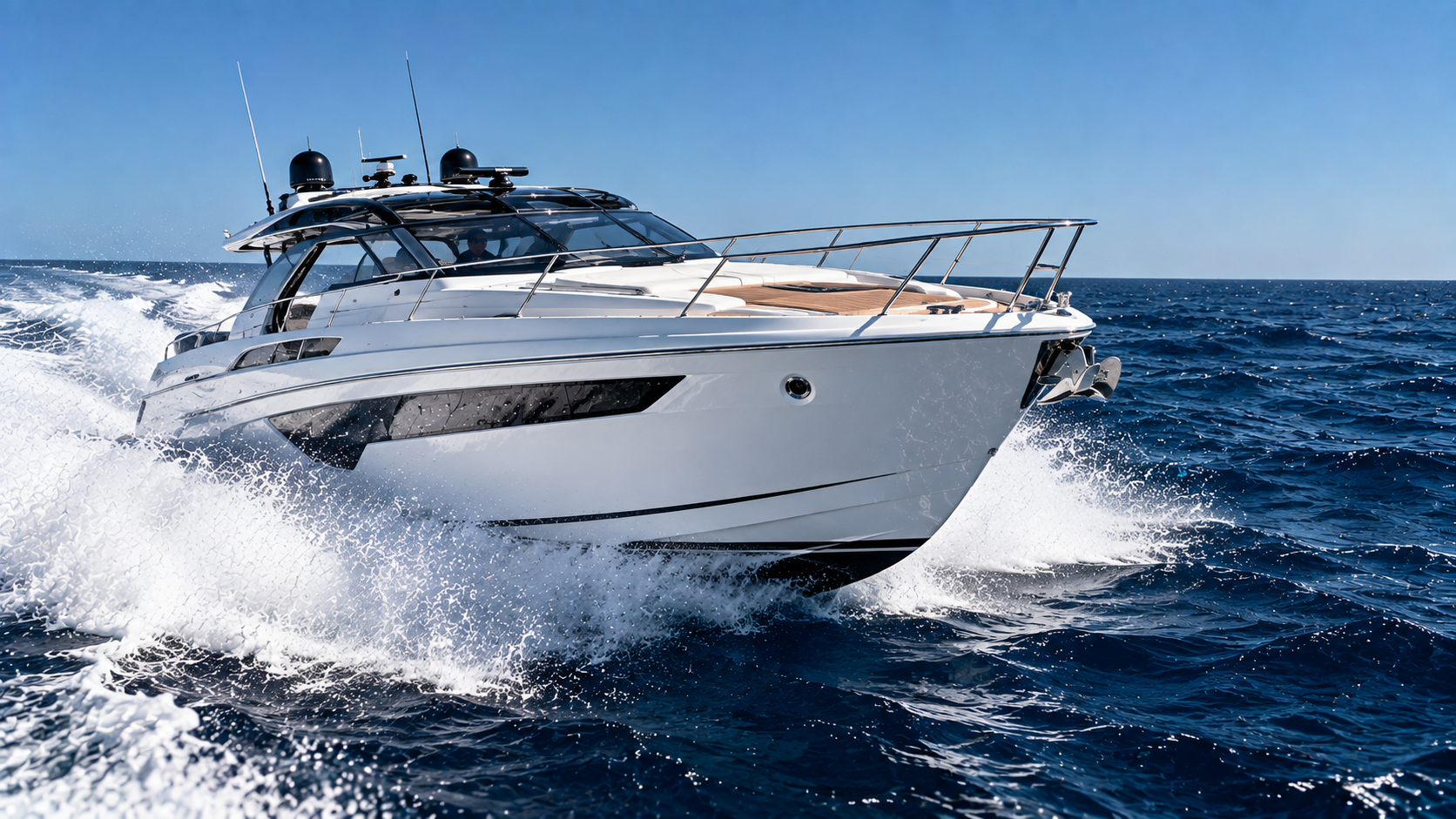 White motor yacht moving across the Aegean Sea